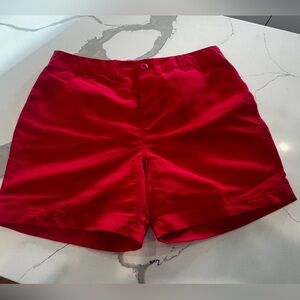Columbia PFG Womens shorts. The shorts are a coral reddish pink color.